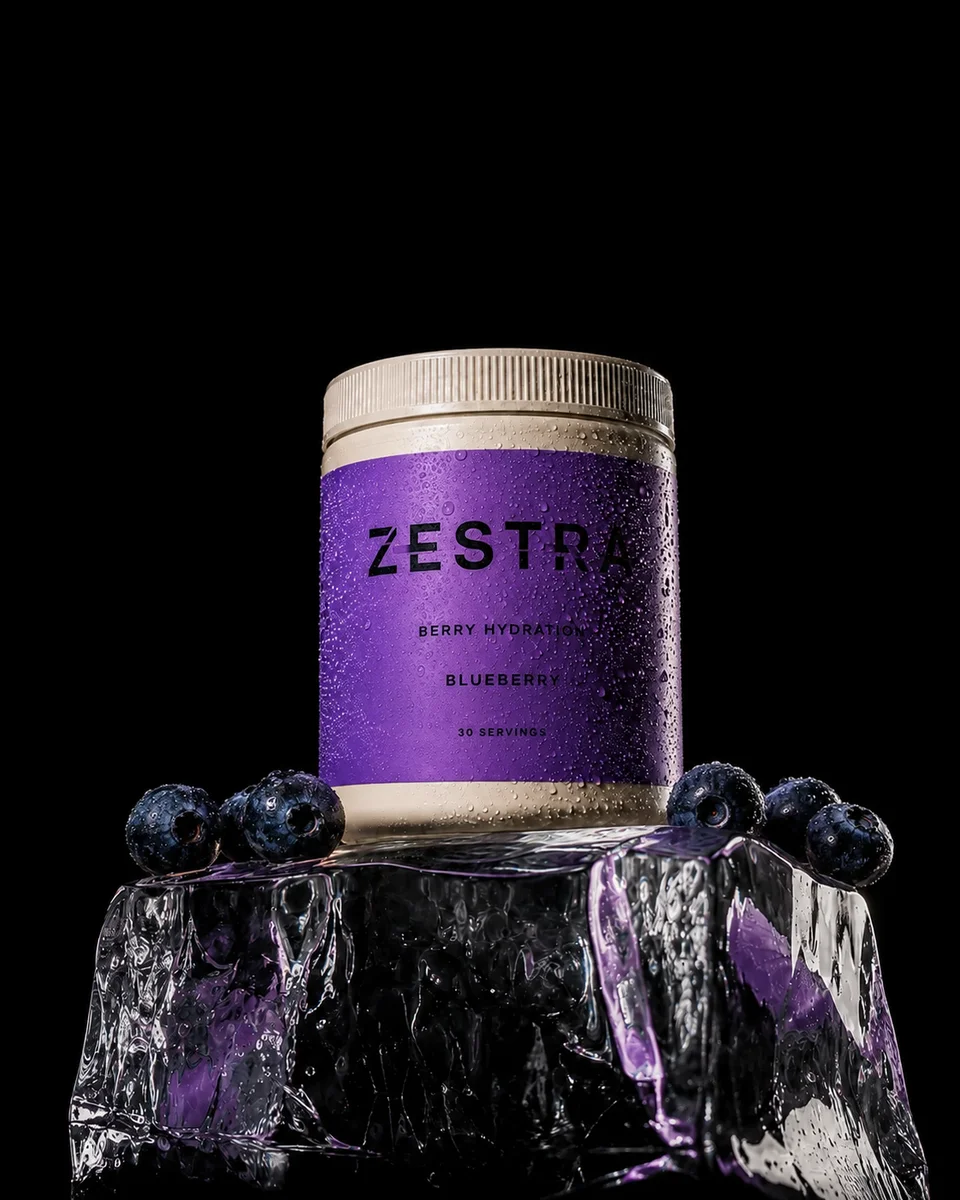 ZESTRA blueberry hydration concept with a purple label, fresh blueberries and sculptural ice